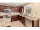 Stylish kitchen featuring granite countertops, stainless steel appliances, and tile backsplash at 2708 E Desert Rose Trl, San Tan Valley, AZ 85143