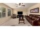 Comfortable living room featuring natural light, plush seating, and modern entertainment center at 2708 E Desert Rose Trl, San Tan Valley, AZ 85143