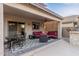 Covered patio featuring comfortable seating, a ceiling fan, and stylish flooring for outdoor relaxation at 2708 E Desert Rose Trl, San Tan Valley, AZ 85143