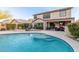 Inviting backyard pool with stairs, surrounded by a patio and lounge area; perfect for relaxation and outdoor enjoyment at 2708 E Desert Rose Trl, San Tan Valley, AZ 85143