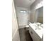 Bright bathroom features a shower over tub, stylish vanity, and a modern aesthetic at 2734 N Trevino Pl, Mesa, AZ 85215