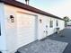 Close up view of a two-car garage with attached exterior lighting fixture at 2734 N Trevino Pl, Mesa, AZ 85215