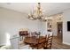 Charming dining room with a unique antler chandelier and a wooden table set for a cozy meal at 30416 N 64Th Street --, Cave Creek, AZ 85331