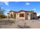 Charming desert home featuring desert landscaping, red window shutters, and a classic Spanish tile roof at 30416 N 64Th Street --, Cave Creek, AZ 85331