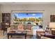 Spacious living room with view of backyard pool, desert landscaping, and cabana at 30416 N 64Th Street --, Cave Creek, AZ 85331