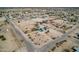 Expansive aerial view of a neighborhood featuring diverse homes and desert landscapes at 30446 W Portland St, Buckeye, AZ 85396