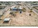 An aerial shot showing the home's large lot and light blue home with a large yard at 30446 W Portland St, Buckeye, AZ 85396