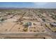 Wide angle aerial of a light blue home within a community in Arizona at 30446 W Portland St, Buckeye, AZ 85396