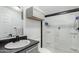 Cozy bathroom with shower, white ceramic sink, and gray countertops at 30446 W Portland St, Buckeye, AZ 85396