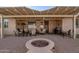 Covered back patio with fire pit, grill, and comfortable lounge seating at 3061 S Elderwood --, Mesa, AZ 85212