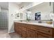 Bathroom featuring double sinks, granite countertops, and a large mirror at 3061 S Elderwood --, Mesa, AZ 85212