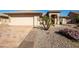 Beautiful single-story home featuring manicured landscaping, brick accents, and attached two-car garage at 3061 S Elderwood --, Mesa, AZ 85212