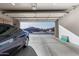 Well lit garage with sleek car, epoxy floors, and bright lighting at 3061 S Elderwood --, Mesa, AZ 85212