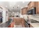 Kitchen featuring stainless steel appliances, ample counter space, and elegant wooden cabinetry at 3061 S Elderwood --, Mesa, AZ 85212