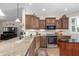 Kitchen featuring stainless steel appliances, ample counter space, and elegant wooden cabinetry at 3061 S Elderwood --, Mesa, AZ 85212