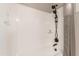 Clean white shower and tub combo features a rainfall shower head at 3061 S Elderwood --, Mesa, AZ 85212