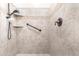 Updated tile shower features a grab bar and handheld shower head at 3061 S Elderwood --, Mesa, AZ 85212