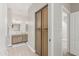 Bathroom with wood cabinets, a mirror, and a tiled floor at 3117 S Signal Butte Rd # 501, Mesa, AZ 85212