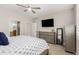 Bedroom with neutral tones, a ceiling fan, and a dresser at 3117 S Signal Butte Rd # 501, Mesa, AZ 85212