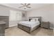 Cozy bedroom with a queen-sized bed, neutral colors, and a ceiling fan at 3117 S Signal Butte Rd # 501, Mesa, AZ 85212