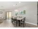 Dining room with modern table and chairs, chandelier, and view of the backyard at 3117 S Signal Butte Rd # 501, Mesa, AZ 85212