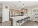 Open kitchen featuring stainless steel appliances, a spacious island, and modern pendant lighting at 3117 S Signal Butte Rd # 501, Mesa, AZ 85212