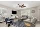 Comfortable living room with modern furnishings, a ceiling fan, and ample natural light at 3117 S Signal Butte Rd # 501, Mesa, AZ 85212