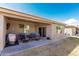 Covered patio area with seating and view of manicured lawn at 3117 S Signal Butte Rd # 501, Mesa, AZ 85212