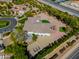 A wide aerial shot featuring a well-maintained home with landscaping and decorative hardscape at 3527 E Indigo Cir, Mesa, AZ 85213