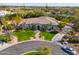 An aerial shot of a home with well-manicured landscaping and a circular driveway at 3527 E Indigo Cir, Mesa, AZ 85213