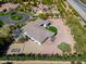 Expansive aerial view of a home in a desert community featuring beautiful landscape and decorative backyard at 3527 E Indigo Cir, Mesa, AZ 85213