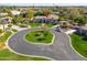 An aerial shot of a home with a circular driveway and lush landscaping at 3527 E Indigo Cir, Mesa, AZ 85213