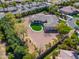 An aerial view of a large, suburban home with a putting green in the backyard at 3527 E Indigo Cir, Mesa, AZ 85213