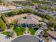 An aerial view of a large home with circular drive and mature landscaping at 3527 E Indigo Cir, Mesa, AZ 85213