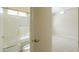 Bright bathroom featuring white shower-tub and a peek into the bedroom at 3527 E Indigo Cir, Mesa, AZ 85213