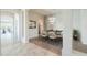 Dining room with decorative wall, modern lighting, and an open view of the living spaces at 3527 E Indigo Cir, Mesa, AZ 85213