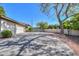 A concrete driveway leading up to a three-car garage at 3527 E Indigo Cir, Mesa, AZ 85213