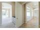 Hallway with arched doorways and a built-in bar area visible through an open door at 3527 E Indigo Cir, Mesa, AZ 85213