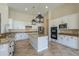 Well-equipped kitchen with a center island, granite countertops, and stainless steel appliances at 3527 E Indigo Cir, Mesa, AZ 85213