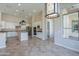 Spacious kitchen with white cabinetry, granite countertops, and stainless steel appliances at 3527 E Indigo Cir, Mesa, AZ 85213