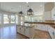 Open-concept kitchen featuring a large island, ample counter space, and pendant lighting at 3527 E Indigo Cir, Mesa, AZ 85213