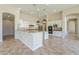 Bright, open kitchen with white cabinetry, granite countertops and pendant lighting at 3527 E Indigo Cir, Mesa, AZ 85213