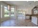 Bright living room with large windows and tile flooring, offering an open and airy atmosphere at 3527 E Indigo Cir, Mesa, AZ 85213