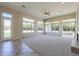 Bright and airy living room with large windows, a fireplace, and access to the backyard at 3527 E Indigo Cir, Mesa, AZ 85213