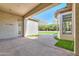 Extended covered patio with a view of the turfed backyard space perfect for outdoor entertaining and relaxation at 3527 E Indigo Cir, Mesa, AZ 85213