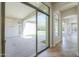 Sliding glass doors provide a seamless transition to the outdoor living on the covered patio at 3527 E Indigo Cir, Mesa, AZ 85213