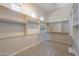 Spacious walk-in closet featuring custom shelving and ample storage space for an organized wardrobe at 3527 E Indigo Cir, Mesa, AZ 85213