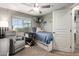 Comfortable bedroom with neutral color scheme, chair, and a ceiling fan at 3763 S Laurel Way, Chandler, AZ 85286