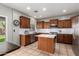 Modern kitchen featuring stainless steel appliances, a center island, and stylish backsplash for cooking enthusiasts at 3763 S Laurel Way, Chandler, AZ 85286