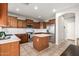 Bright kitchen with stainless steel appliances, center island, and ample cabinet space, ideal for cooking at 3763 S Laurel Way, Chandler, AZ 85286